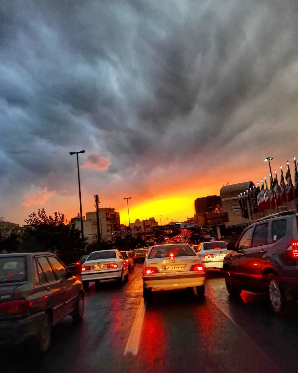 car, transportation, traffic, city, driving, cloud - sky, mode of transport, road, dramatic sky, sunset, no people, romantic sky, sky, yellow taxi, rush hour, outdoors, day