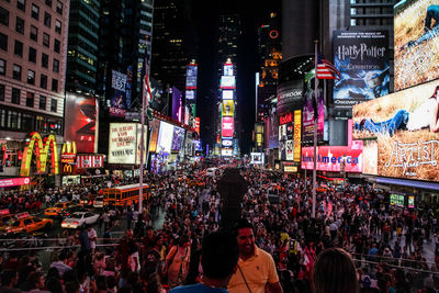 Crowd at times square during night