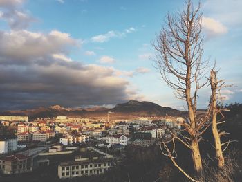 View of buildings in town against sky