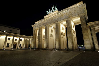 Low angle view of historical building at night