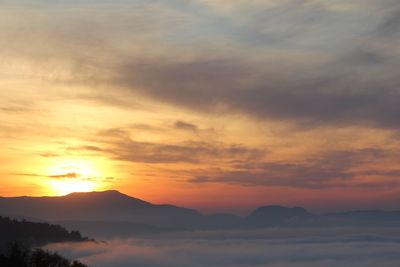 Scenic view of mountains at sunset