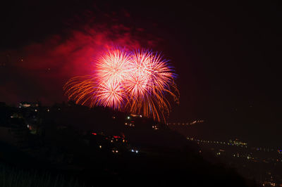 Firework display at night