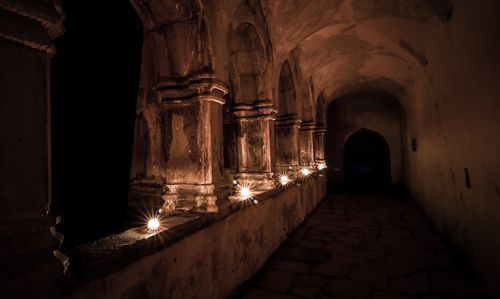 Night time abbey views with candle light in killarney national park, co. kerry, ireland