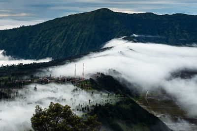 High angle view of trees and mountains against sky