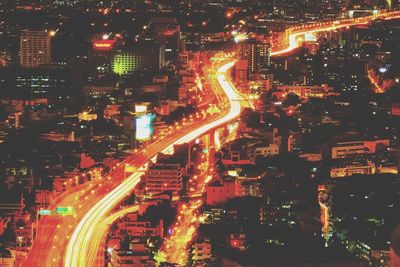 High angle view of illuminated cityscape at night