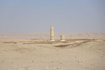 Built structure on sand against clear sky