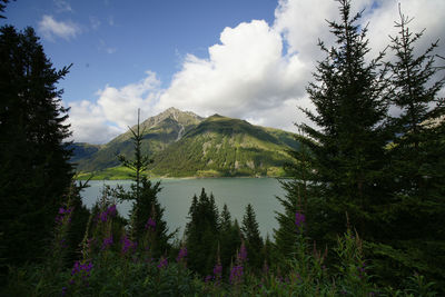 Scenic view of lake against cloudy sky