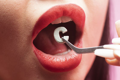 Close-up of alphabet in mouth