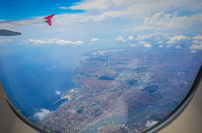 Aerial view of sky seen through airplane window