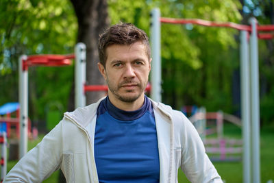 Portrait of young man standing outdoors