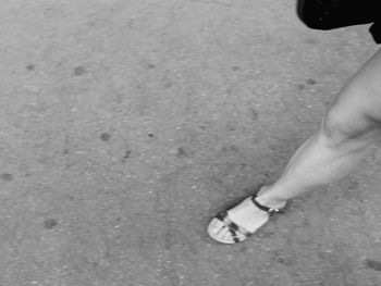 Low section of woman standing on tiled floor