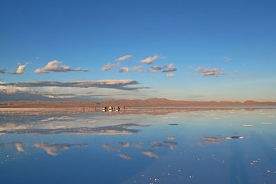 Scenic view of lake against blue sky