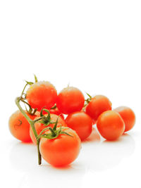 Close-up of tomatoes on white background