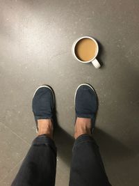 Low section of man standing on floor