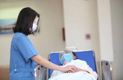 Doctor examining patient in hospital