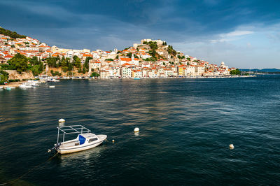 Boats in sea against sky