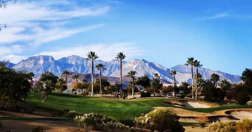 Panoramic view of golf course against sky