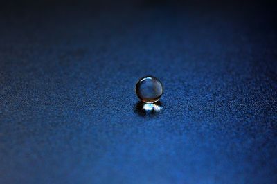 Close-up of transparent marble on table