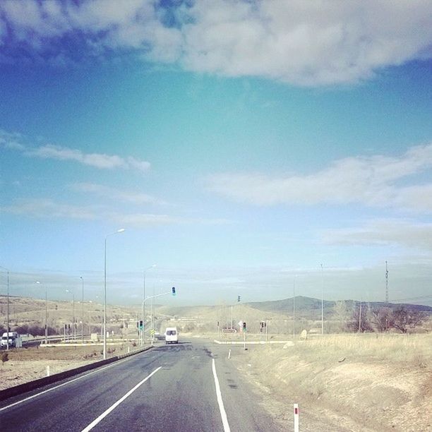 road, transportation, the way forward, road marking, sky, diminishing perspective, vanishing point, landscape, country road, empty road, street, cloud - sky, asphalt, blue, empty, cloud, highway, day, outdoors, long