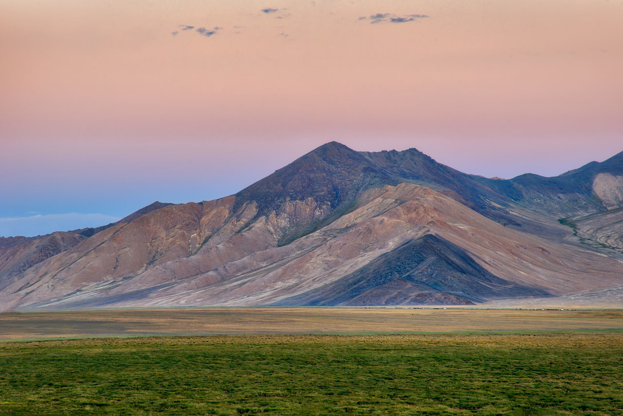 SCENIC VIEW OF LANDSCAPE AND MOUNTAINS AGAINST SKY