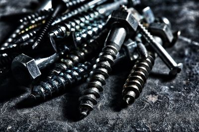 Close-up of screws on table