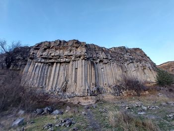 Rock formations on mountain against sky