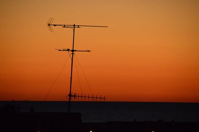 Scenic view of sea against orange sky