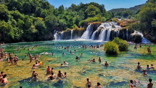 Scenic view of waterfall against sky