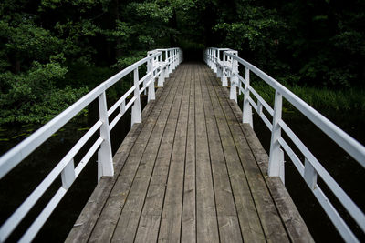 Footbridge against trees