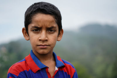 Portrait of a indian pahadi kid who belongs to the mountains.