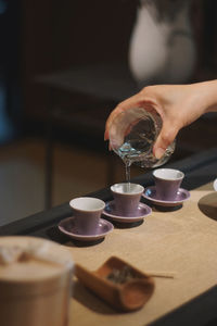 Midsection of coffee cup on table