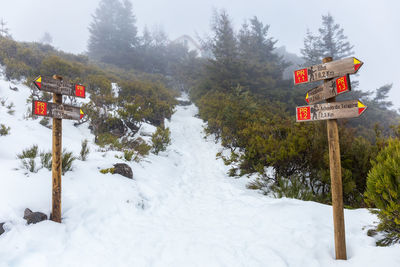 Information sign on snow covered field