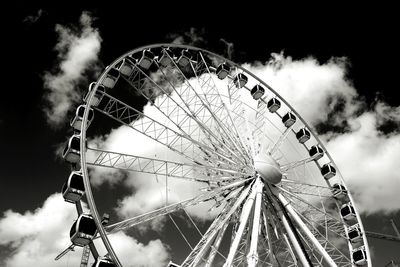 Low angle view of ferris wheel against sky