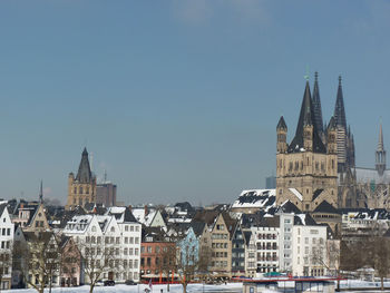 Buildings in city against sky