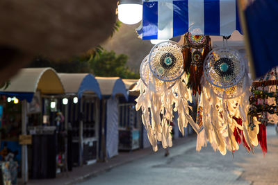 Close-up of illuminated lanterns hanging in market