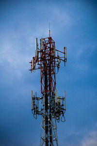 Low angle view of communications tower against sky