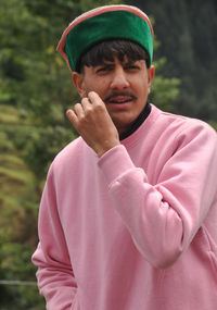 Portrait of young man standing outdoors