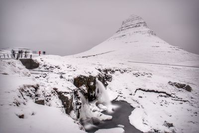 Snow covered mountain against sky