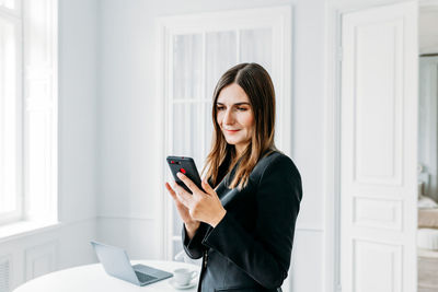 Young woman using mobile phone