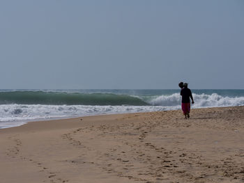 People standing on beach