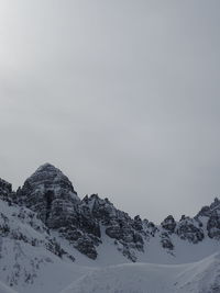 Scenic view of snow covered mountain against sky