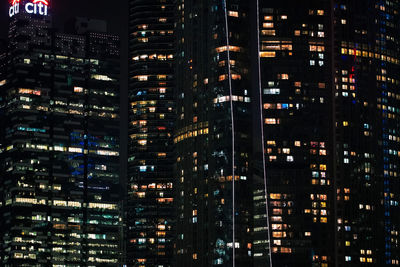 Illuminated buildings in city at night