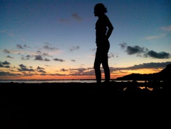 Silhouette of people at sunset