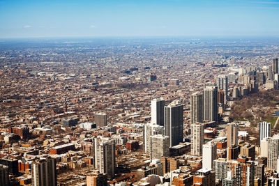 High angle view of modern buildings in city against sky