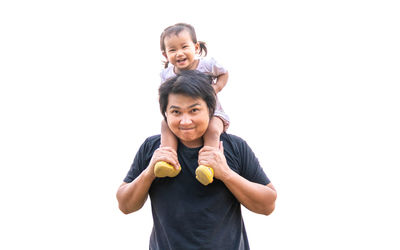 Portrait of smiling boy against white background