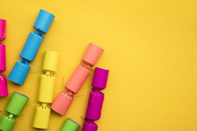 High angle view of beauty products on yellow background