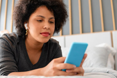 Young woman using mobile phone