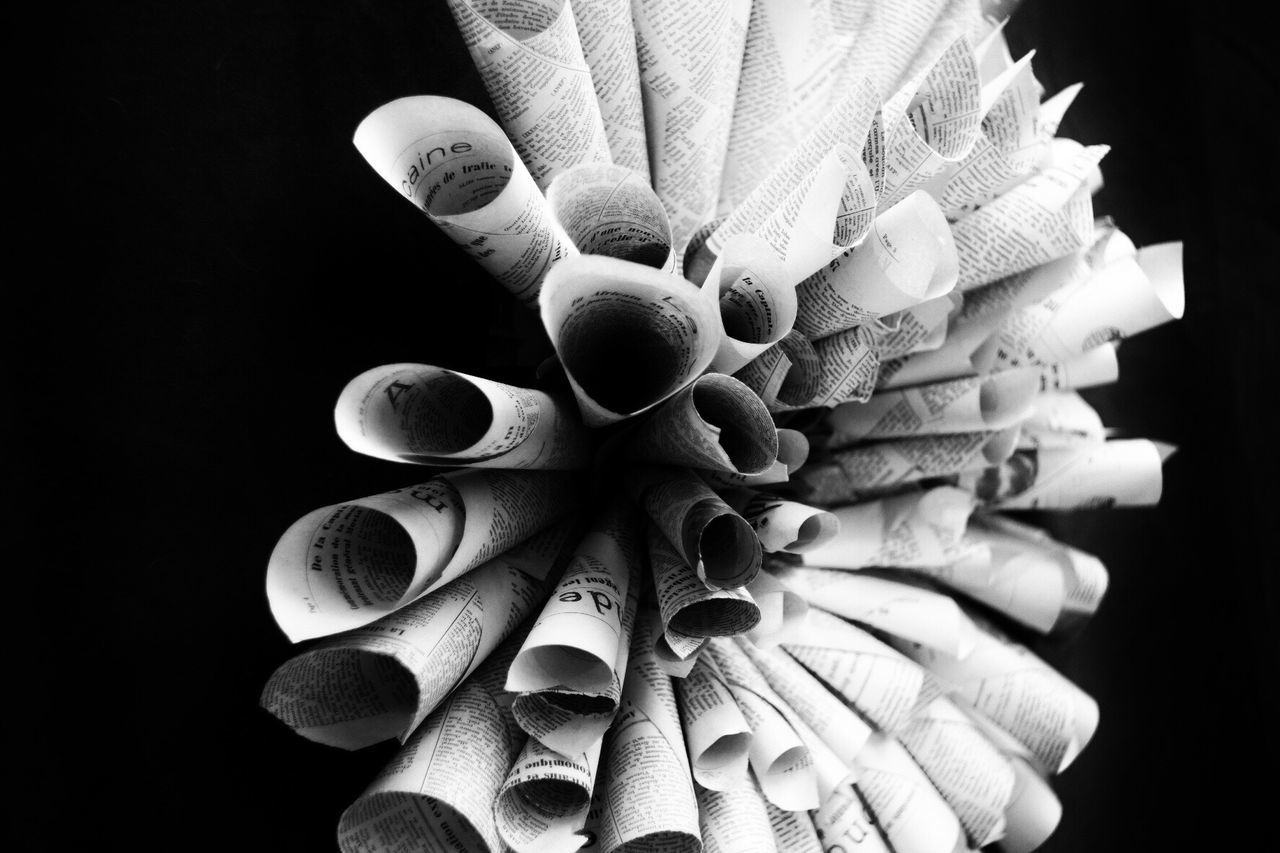 CLOSE-UP OF HANDS OVER BLACK BACKGROUND