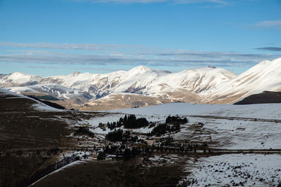 Scenic view of snowcapped mountains against sky in norcia, umbria italy 