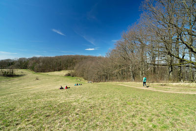 People on field against sky